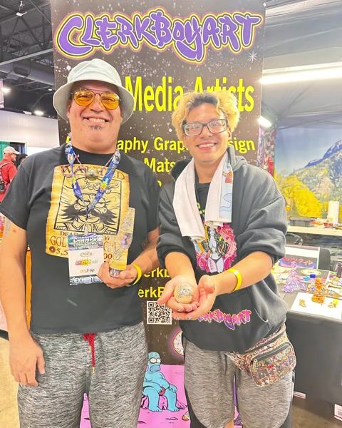 Clerkboyart: Roque Toloza Jr. and son in Denver at Champs